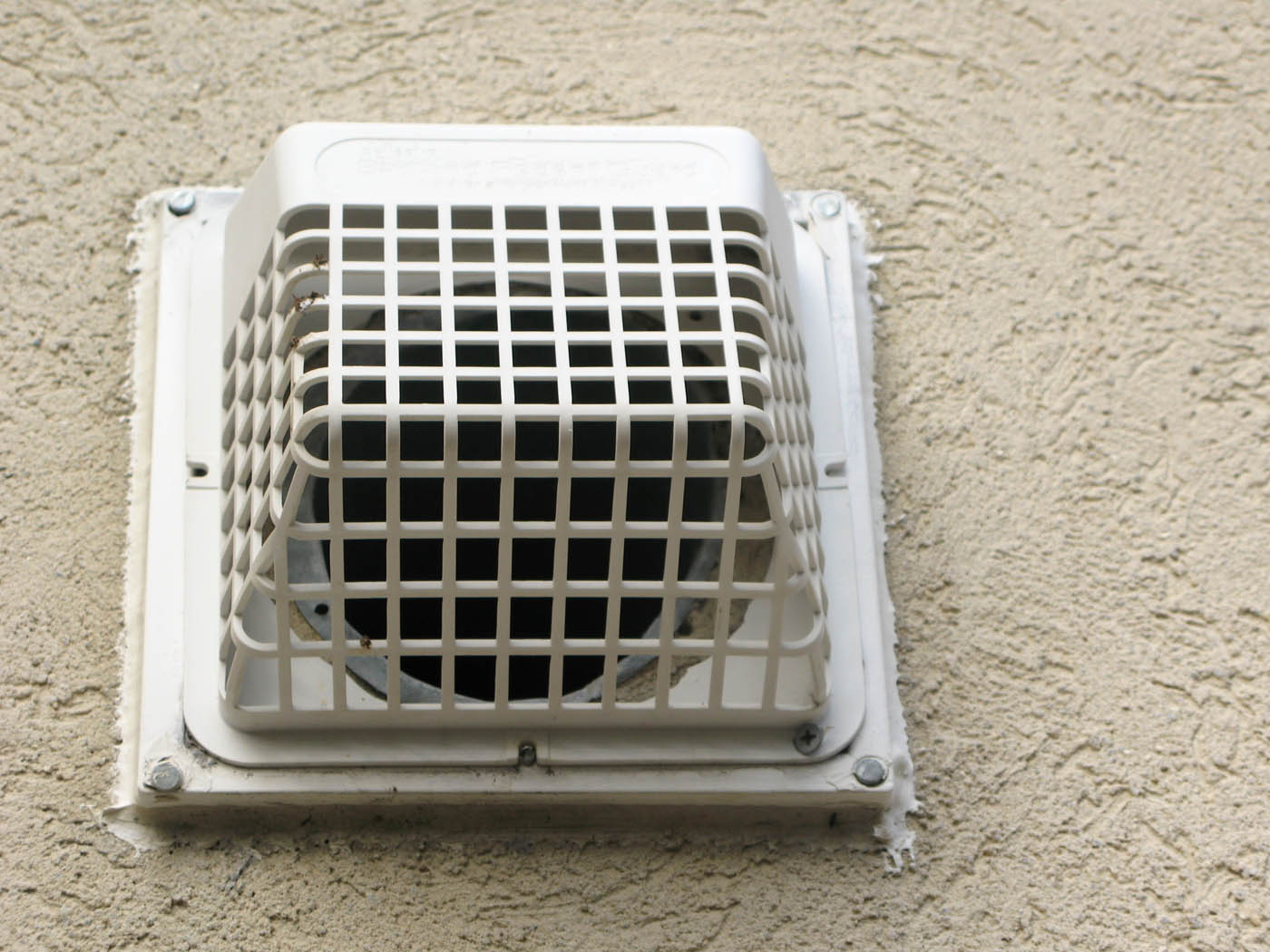 A Window Ninjas Nashville technician cleaning dryer vents in condos in Nashville, TN.