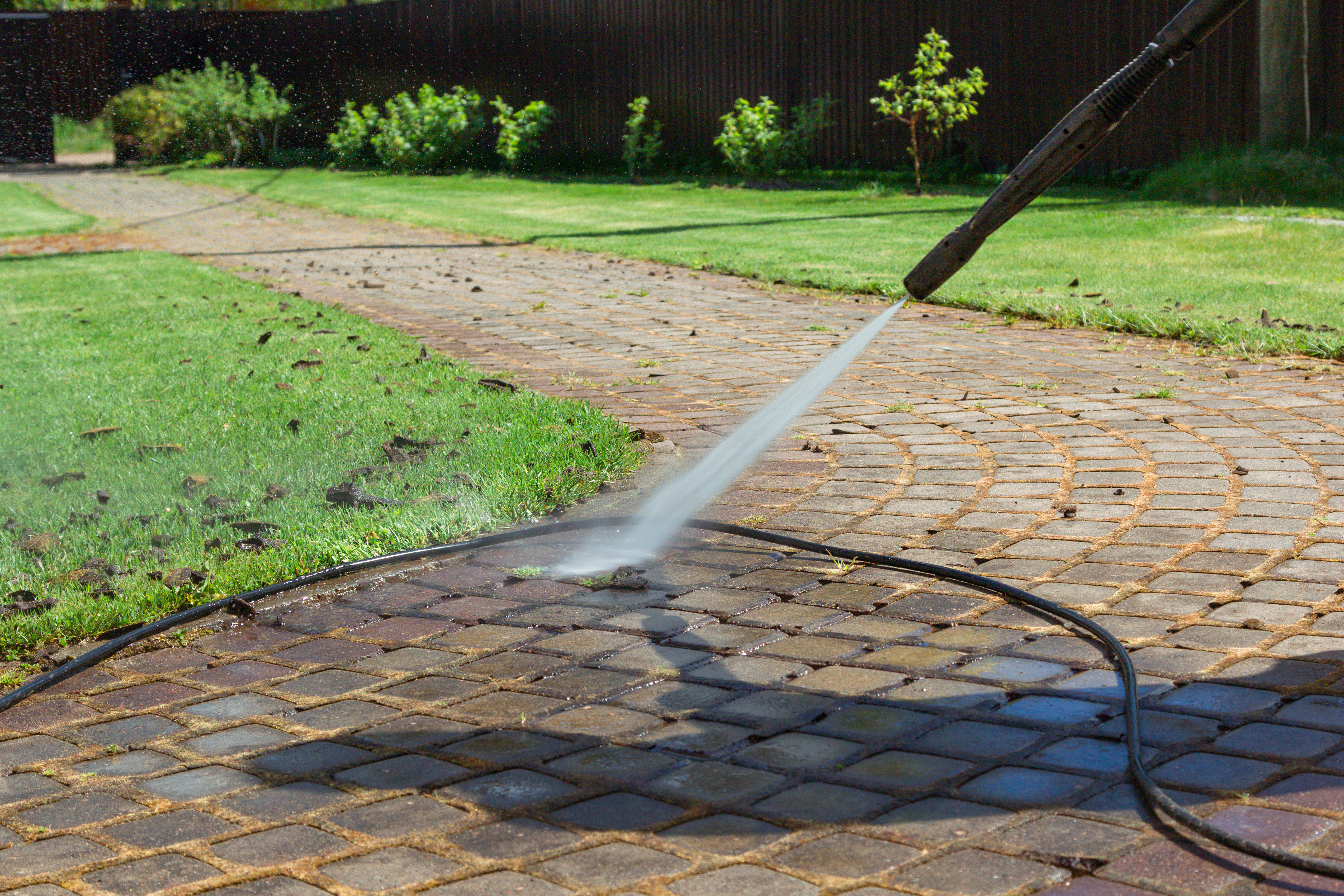 An image of sidewalk pressure washing done by professionals like Window Ninjas Nashville.