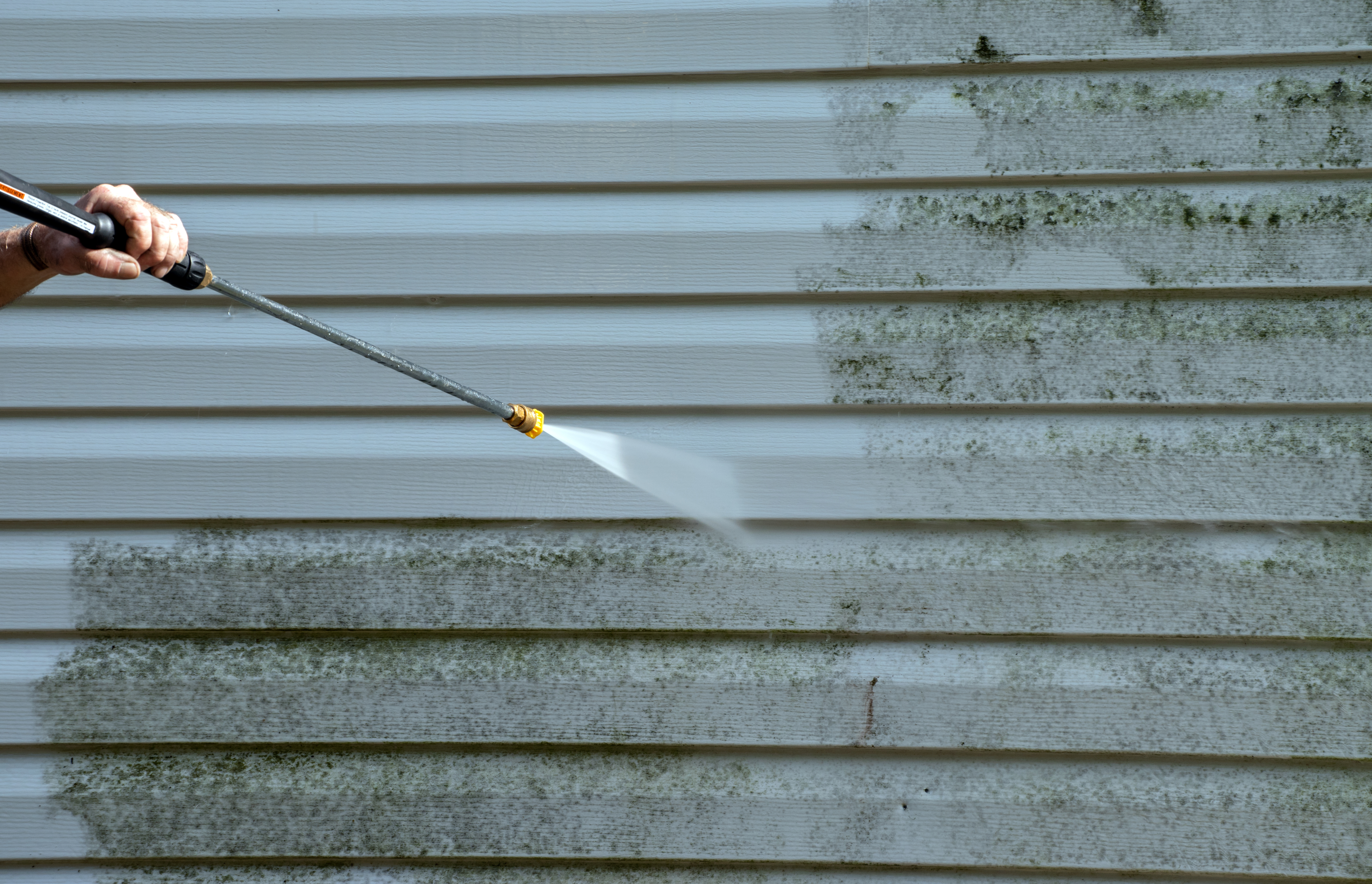 An image of siding pressure washing - Window Ninjas offers services for all types of properties including Virginia Beach vinyl siding cleaning.