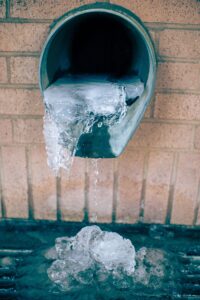 frozen downspout gutter