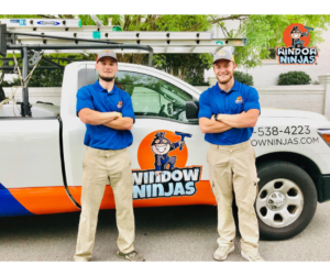 technicians form Window Ninjas standing by truck